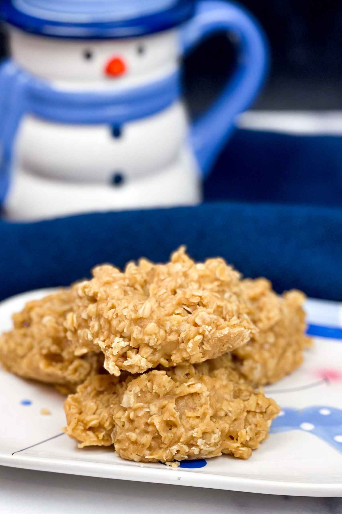 No Bake Peanut Butter Cookies stacked on a plate.