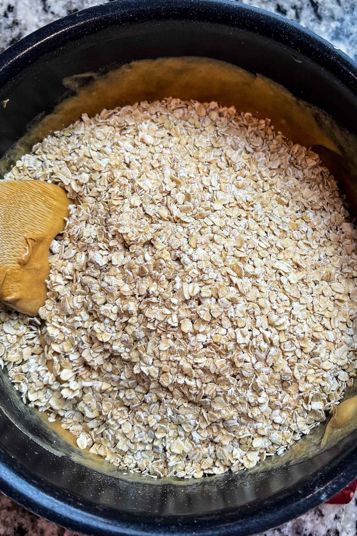 Oatmeal on top of peanut butter mixture.