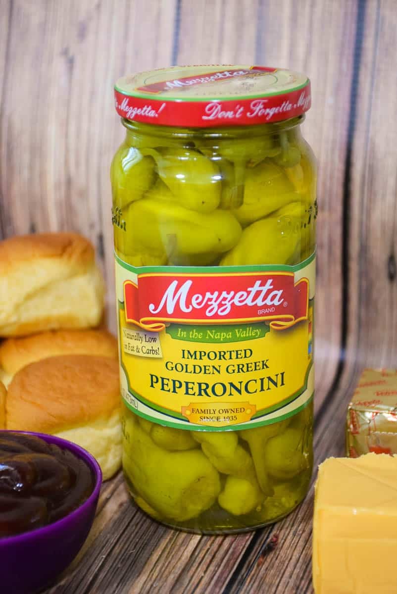 A jar of pickled peperoncini peppers.