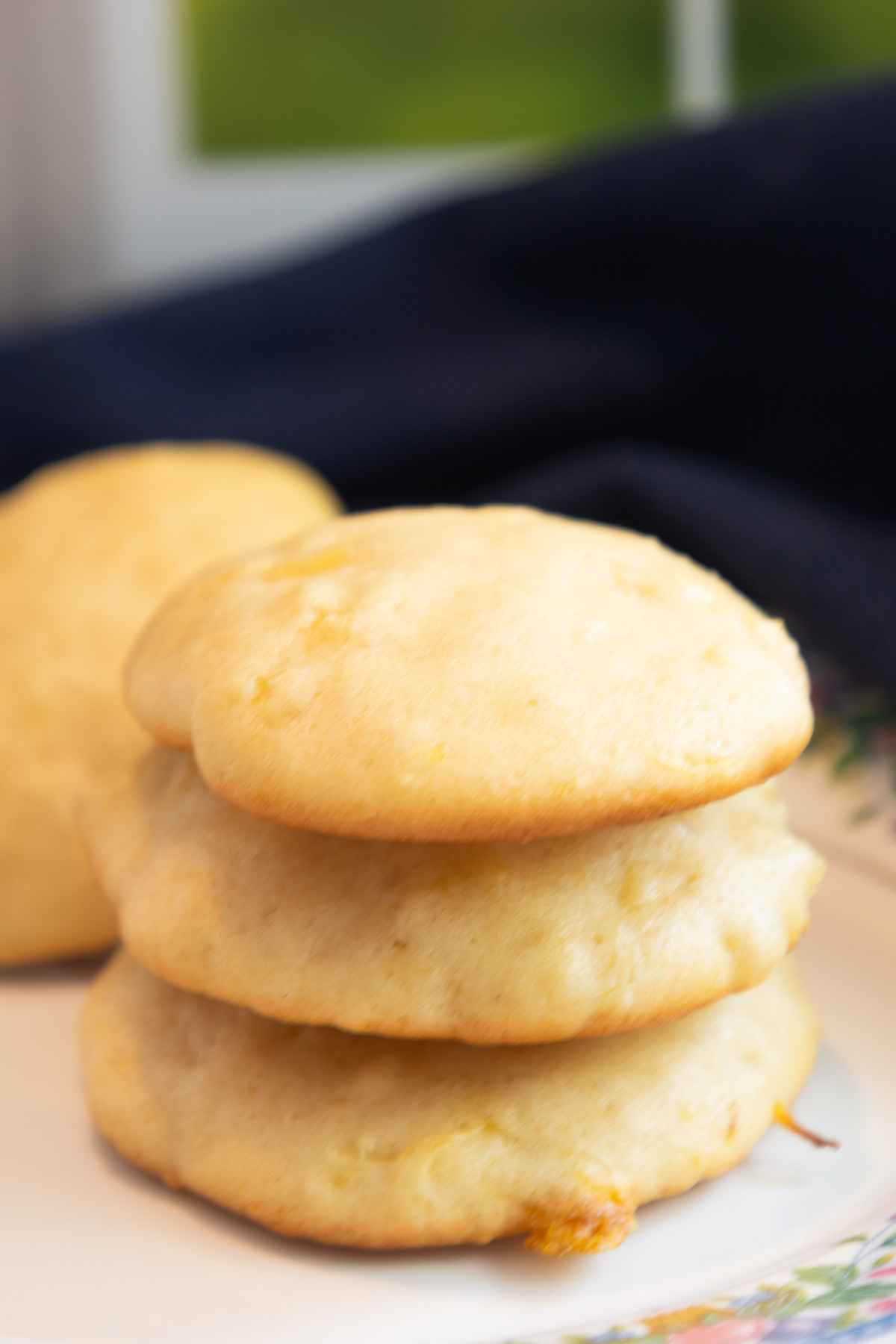 Upclose image of a stack of 3 pineapple cookies.