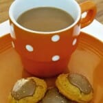 Pumpkin Spice Latte Cookies on an orange plate with a mug of coffee.