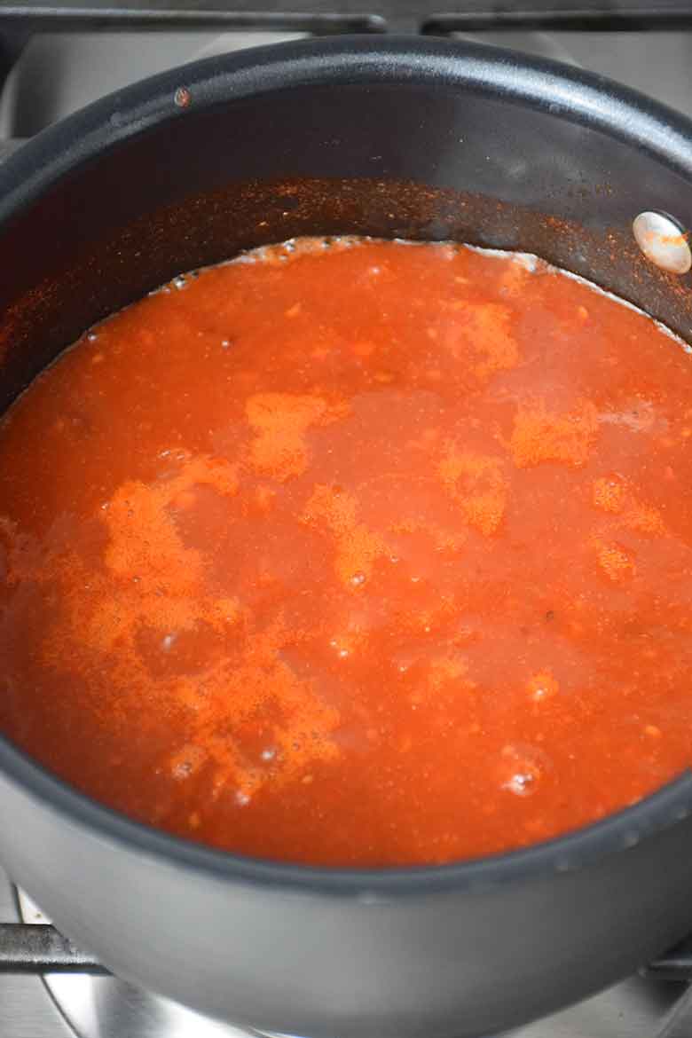 Raspberry Chipotle Sauce simmer on stove