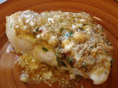 Overhead image of one serving of baked red snapper.