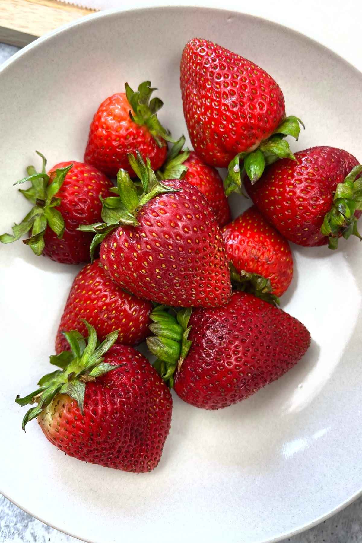 A bowl of fresh strawberries.