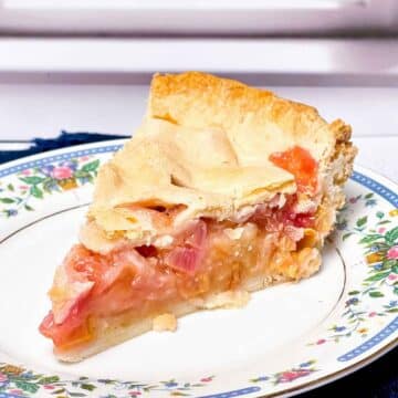 One slice of rhubarb pie on a plate.