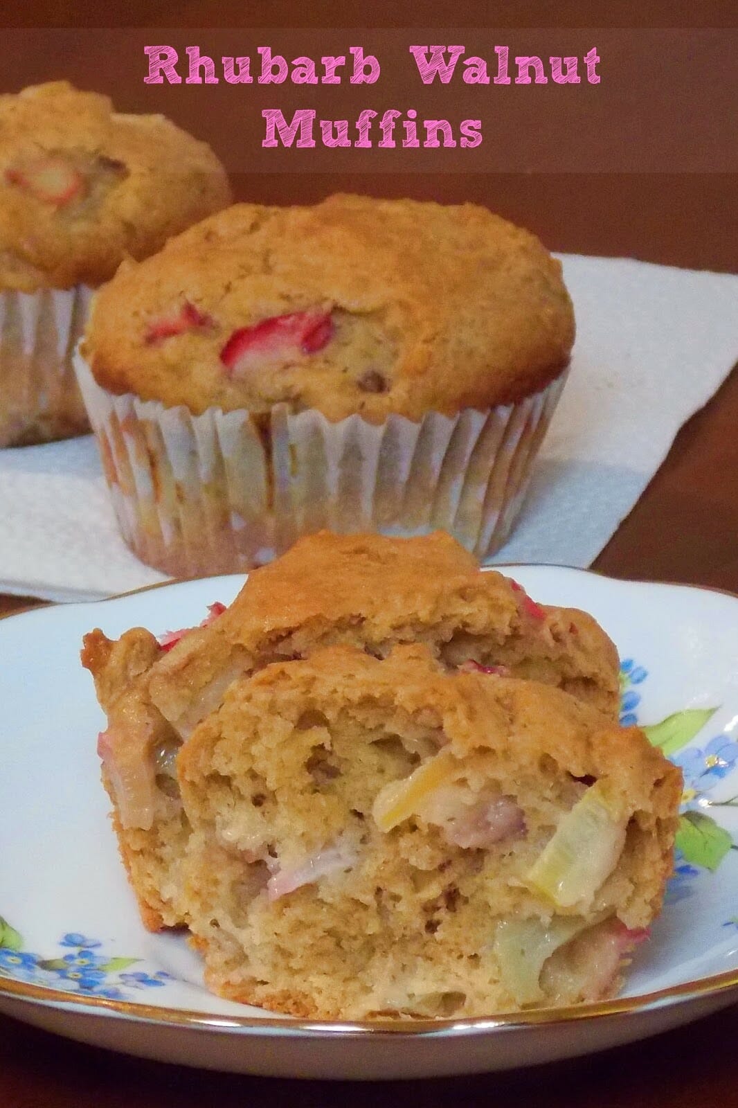 Rhubarb Walnut Muffins, one on a plate split in half with more muffins in the background.
