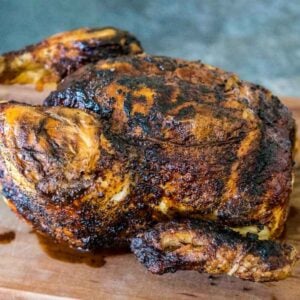 One whole chicken that was cooked in an air fryer rotisserie with golden brown and crispy skin.