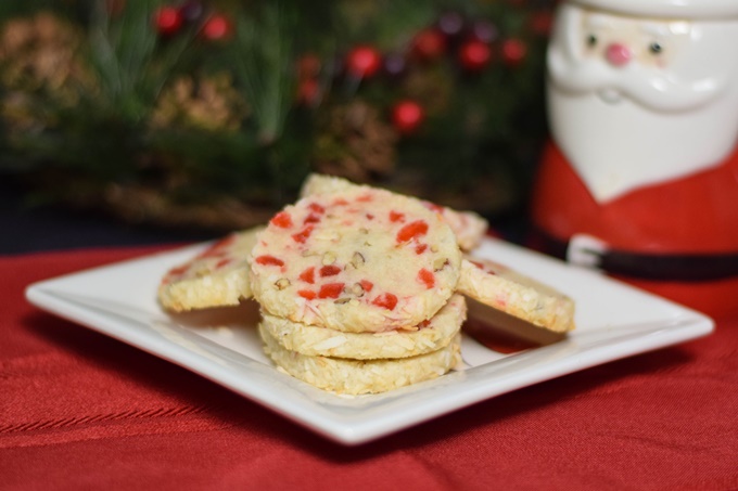 A white plate with stacks of santa's whiskers cookies.