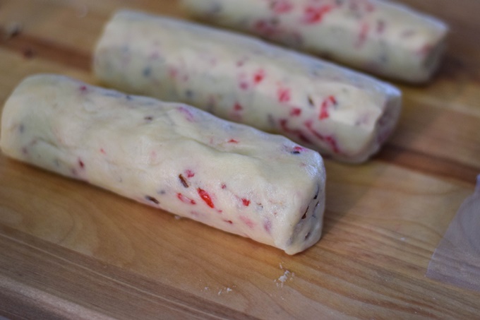 Cookie dough shaped into 3 logs.