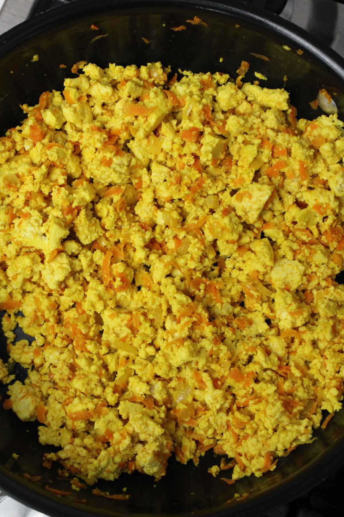 Cooked tofu mixture in a large skillet