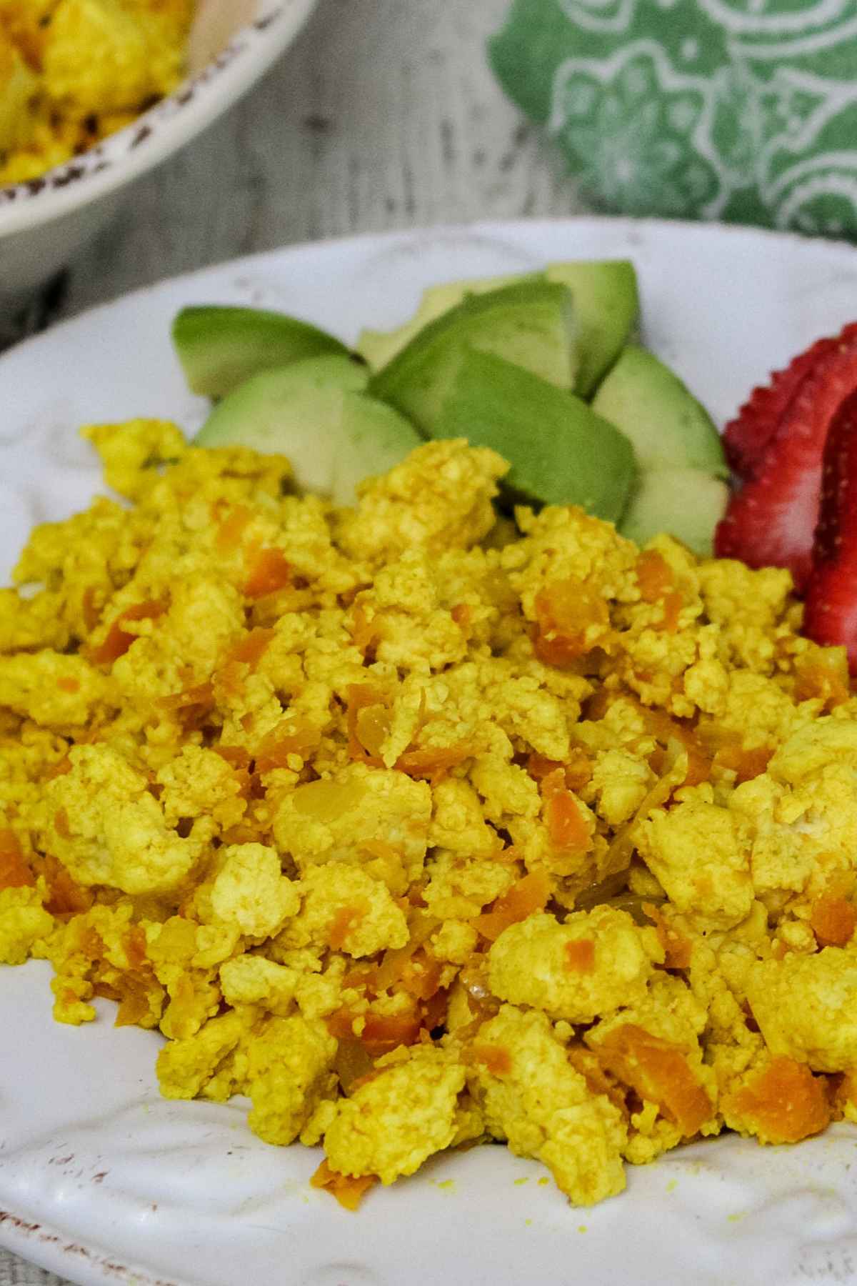 Side angle of scrambled tofu on a plate.