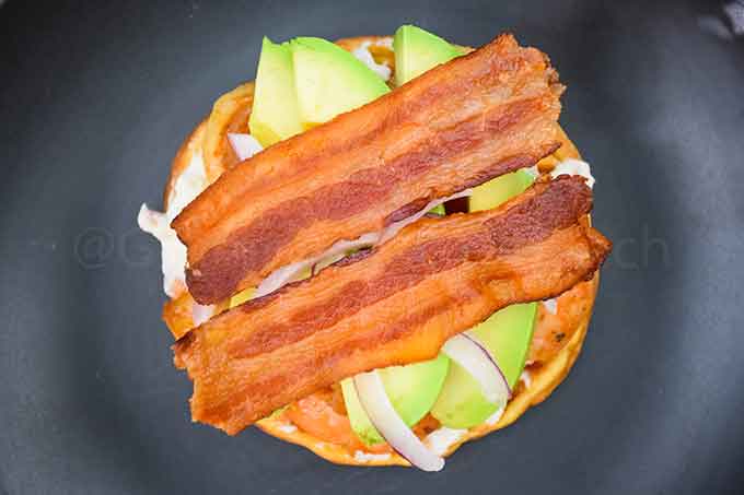 Chaffle with bacon, avocado, and cream cheese spread