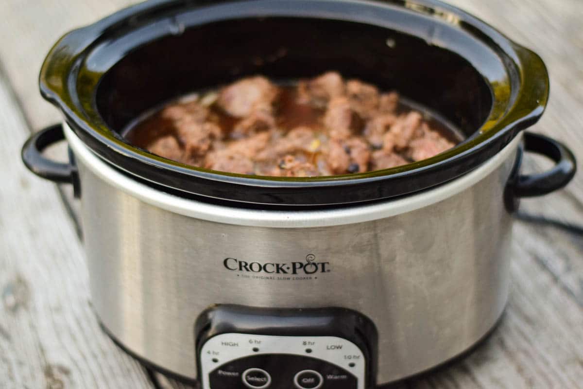 Stew Meat on top of vegetable layer in crockpot