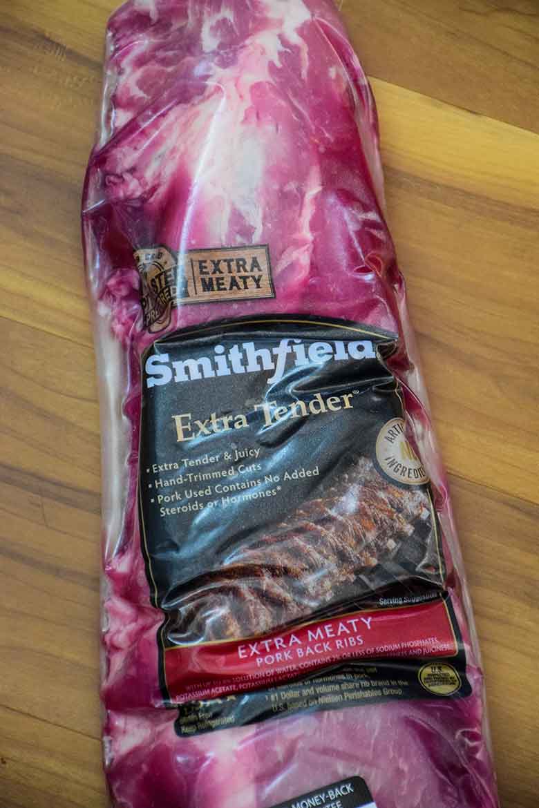 An unopened package of Smithfield Extra Tender Pork Back Ribs on the counter