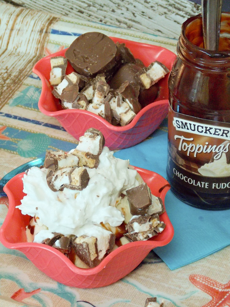 Sundae with chocolate fudge topping, whipped cream and candies.