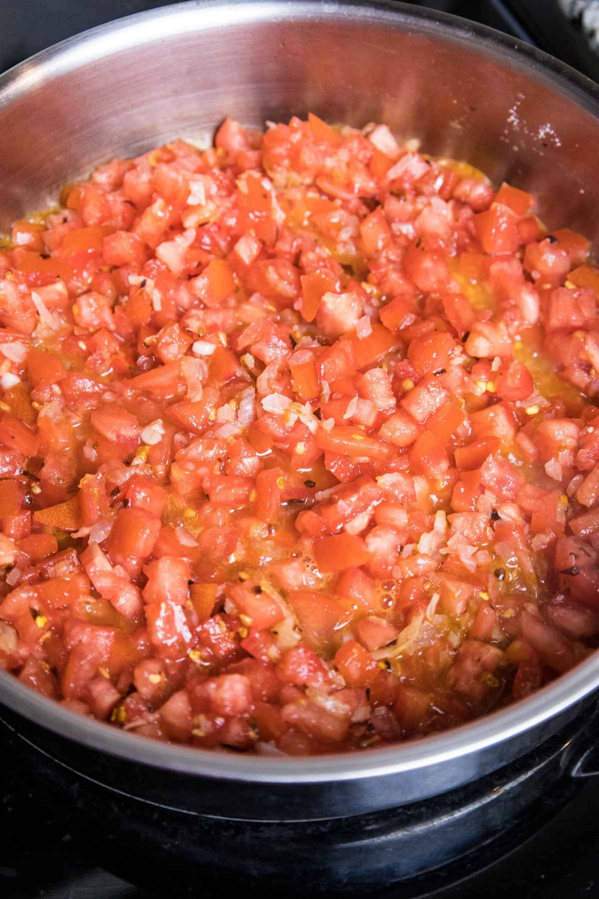 Diced tomatoes in a skillet.