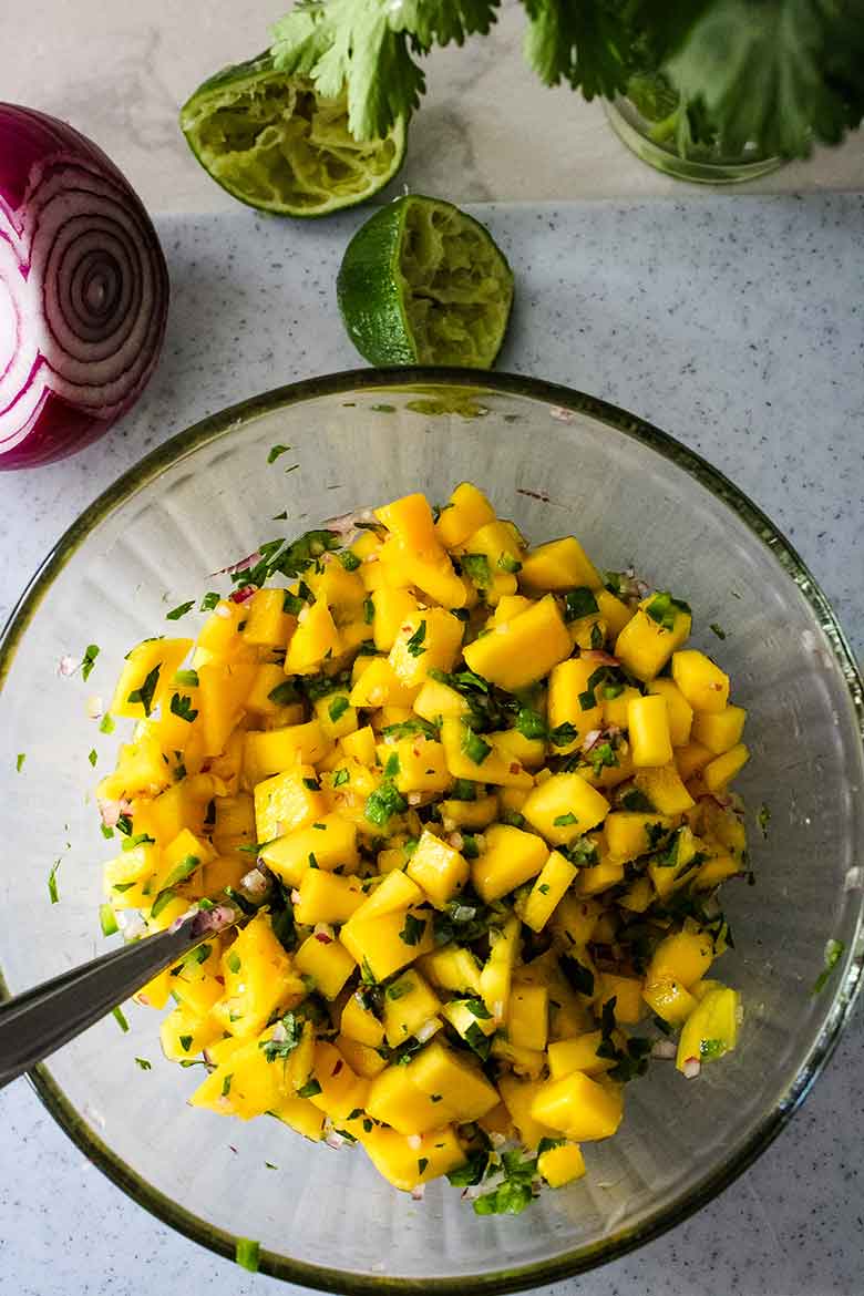 A bowl of mango salsa.