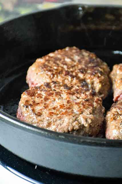 Hamburger steaks browned in skillet