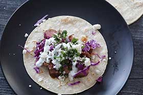 assembled mexican street taco with flank steak.