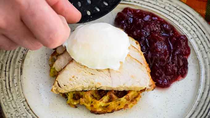 Placing the egg on the Thanksgiving Eggs Benedict