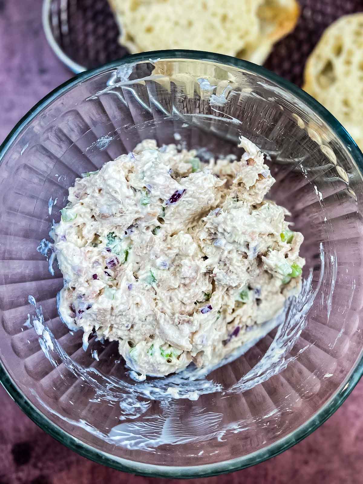 Mixed tuna salad in a glass bowl.