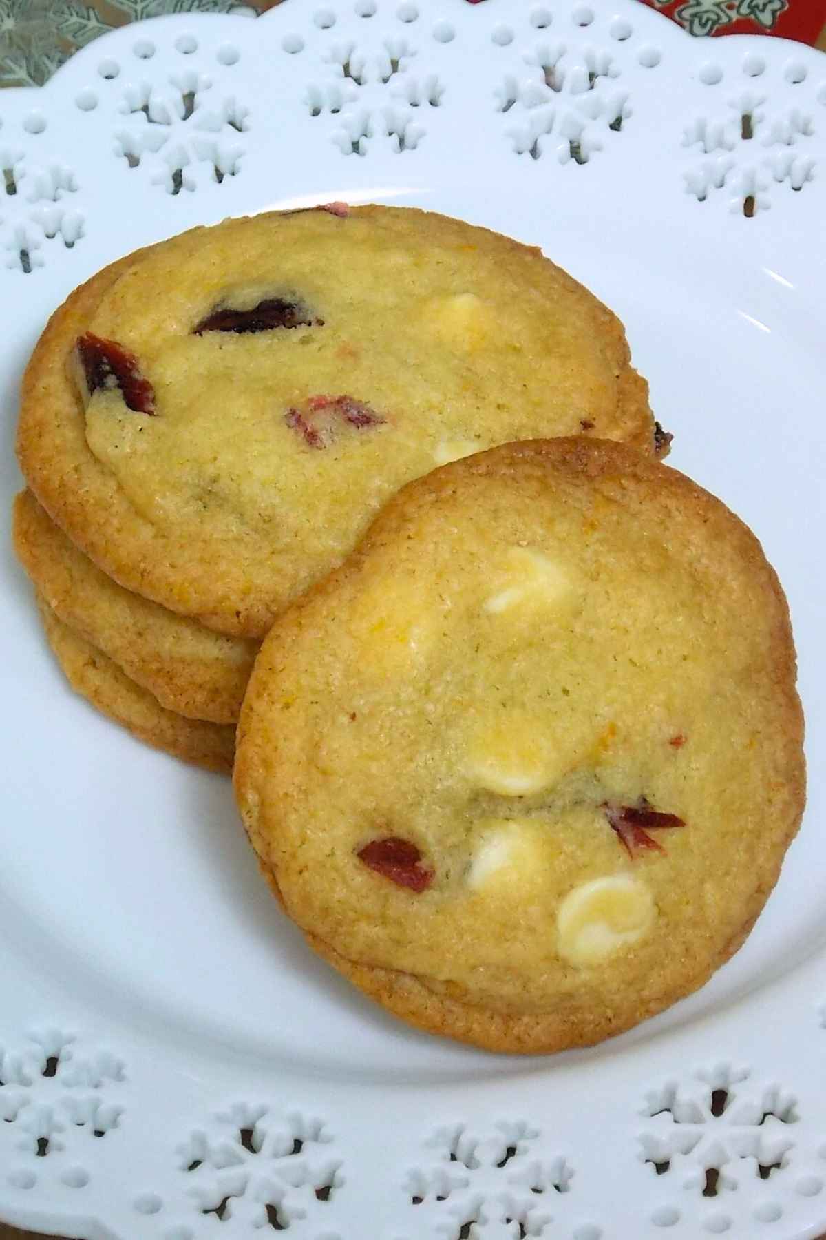 White Chocolate Cranberry Cookies on a white snowflake plate.