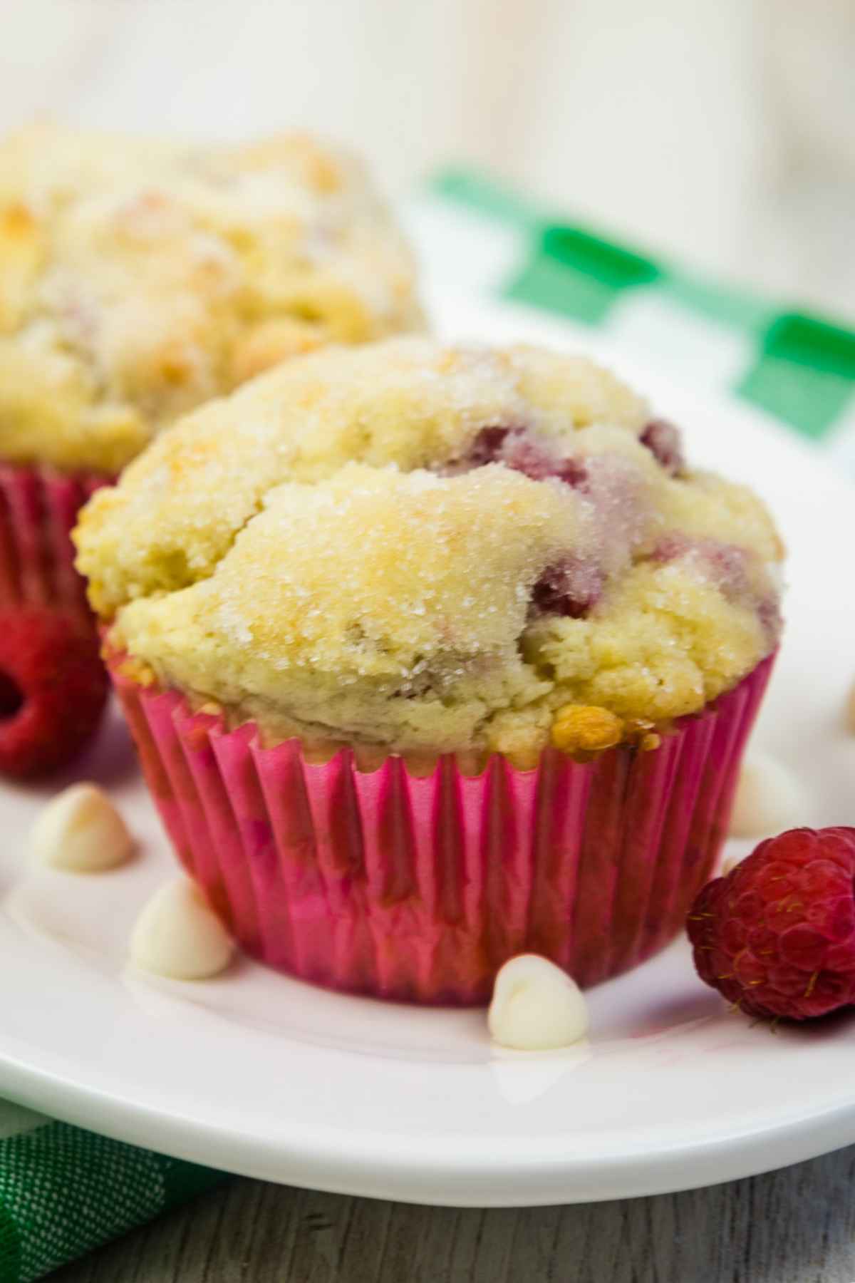 Upclose hero of muffin on a white plate.