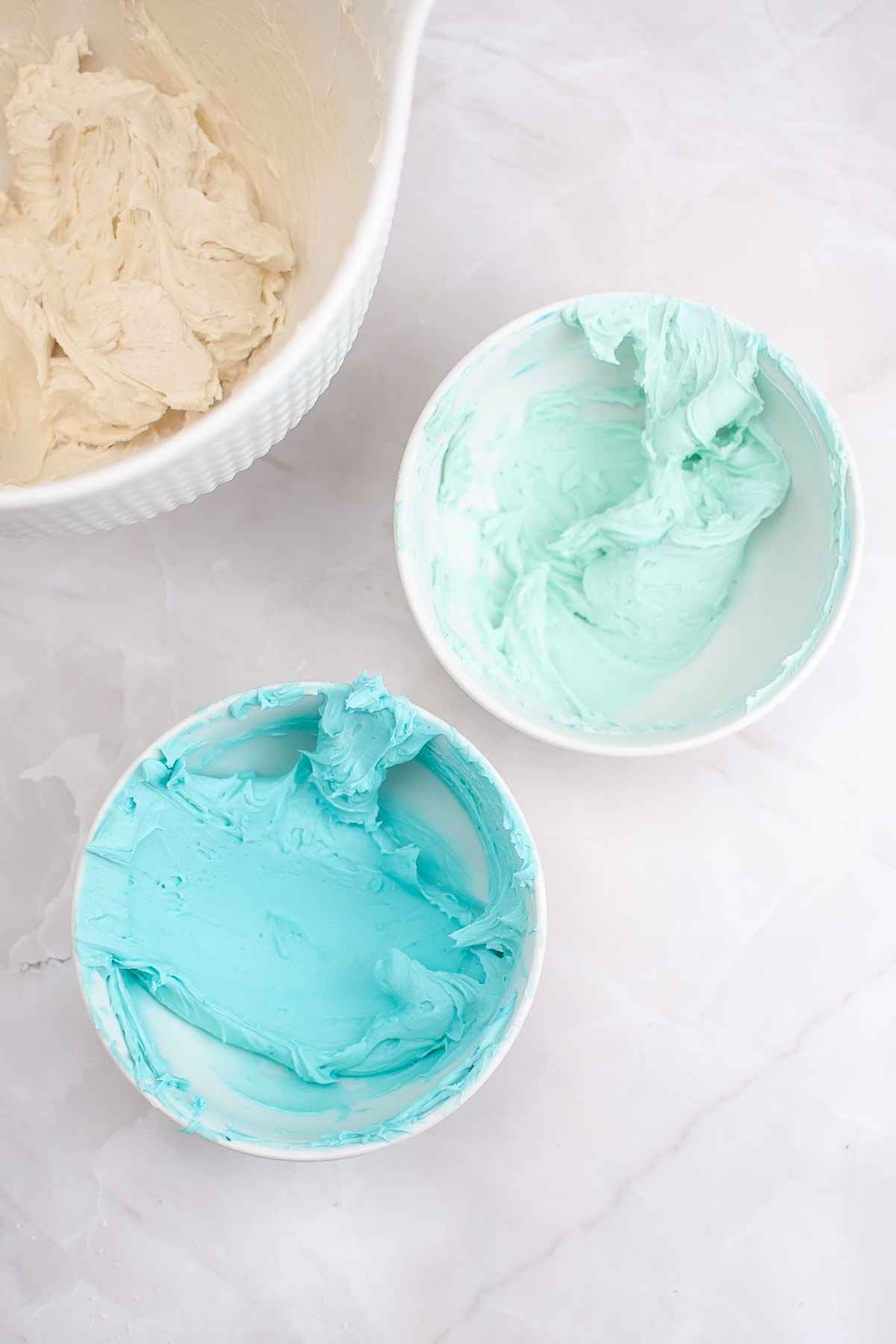 White icing, light blue icing, and dark blue icing.