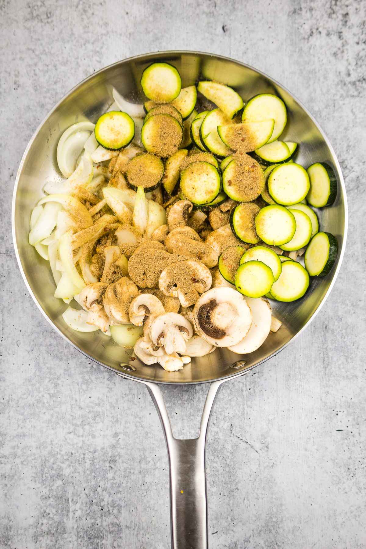 Seasoned veggies in a skillet.